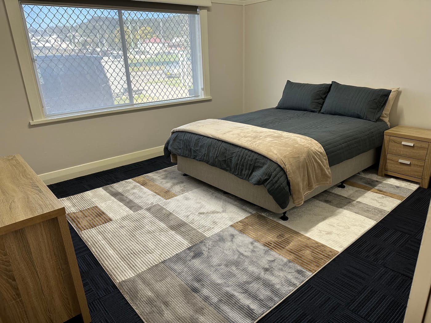 Queen bedroom with leafy views
